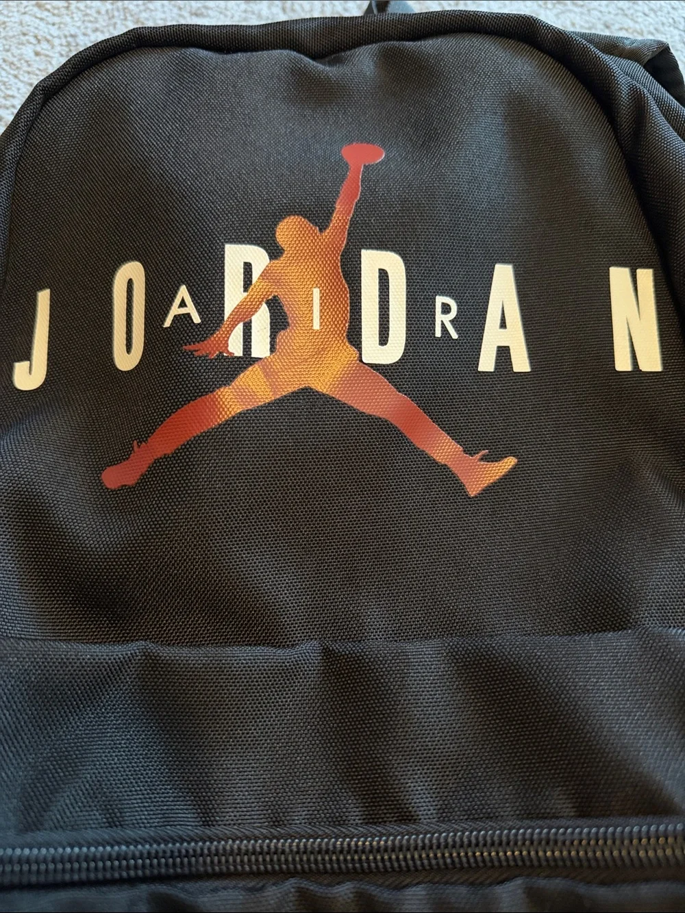 Black Jordan Backpack with Red Jumpman and White Lettering